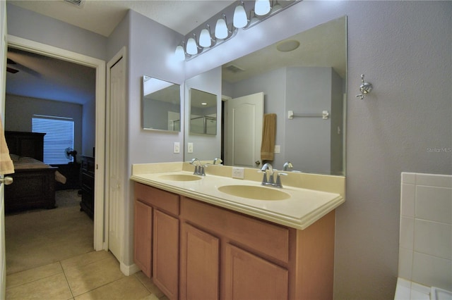 3684 Madbury Cir, Lakeland, FL 33810 - full bath featuring double vanity, visible vents, tile patterned floors, and a sink