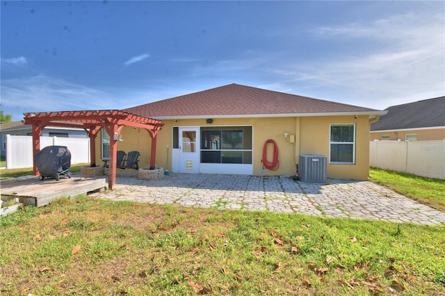 3684 Madbury Cir, Lakeland, FL 33810 - back of house with fence, a pergola, cooling unit, a wooden deck, and a lawn
