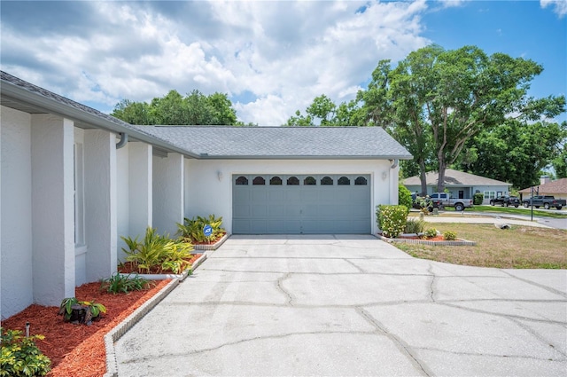 3226 Cherry Hill Cir S, Lakeland, FL 33810 - exterior space with stucco siding, an attached garage, and driveway