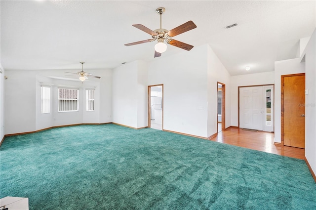3226 Cherry Hill Cir S, Lakeland, FL 33810 - unfurnished living room with ceiling fan, carpet, baseboards, vaulted ceiling, and visible vents