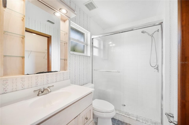 3226 Cherry Hill Cir S, Lakeland, FL 33810 - bathroom with vanity, a shower stall, wallpapered walls, and toilet