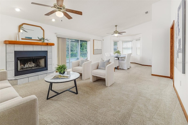 3226 Cherry Hill Cir S, Lakeland, FL 33810 - living room with a ceiling fan, carpet flooring, plenty of natural light, vaulted ceiling, and a fireplace
