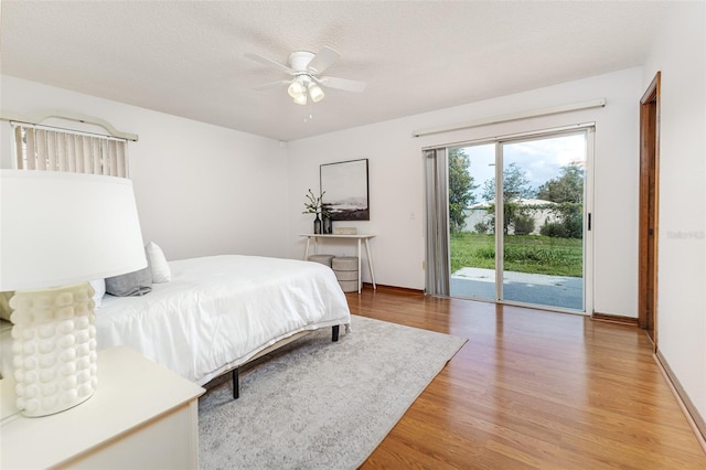 3226 Cherry Hill Cir S, Lakeland, FL 33810 - bedroom with access to outside, wood finished floors, and a ceiling fan