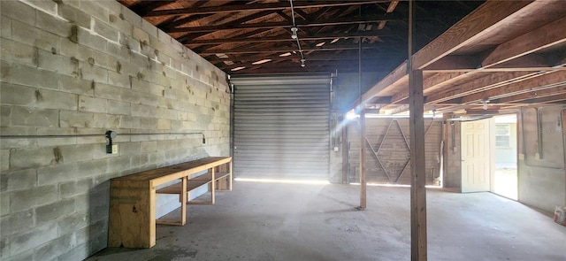 below grade area with concrete block wall