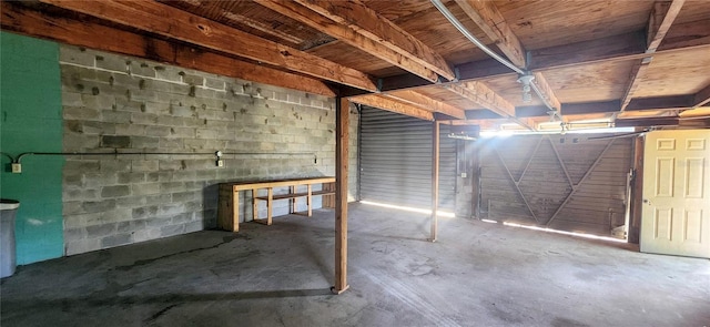 garage with concrete block wall