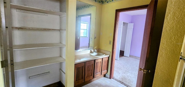 bathroom featuring vanity and tile patterned flooring
