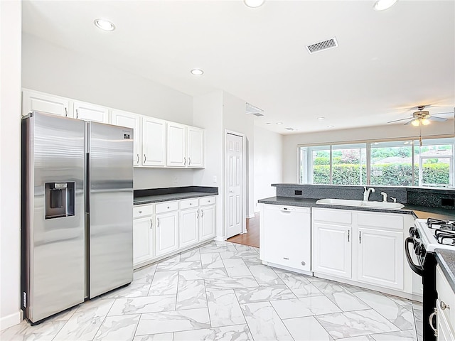 kitchen with a sink, stainless steel fridge with ice dispenser, dishwasher, marble finish floor, and black range with gas cooktop