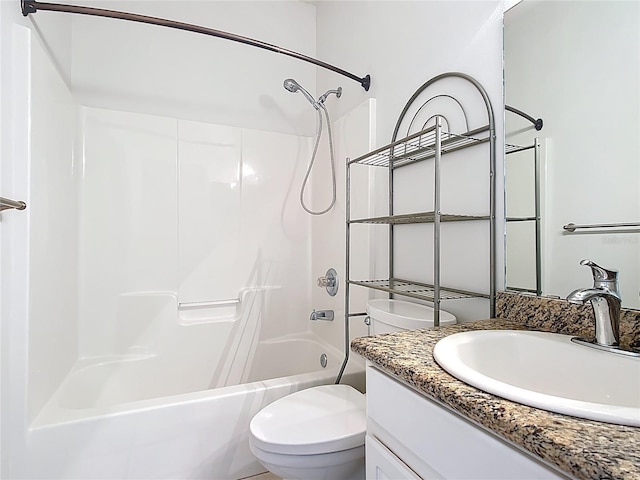 full bath featuring vanity, bathtub / shower combination, and toilet