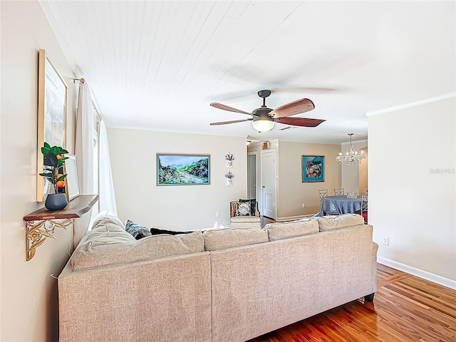 737 Kensington St, Lakeland, FL 33803 - living area with dark wood-style flooring, baseboards, and ceiling fan with notable chandelier