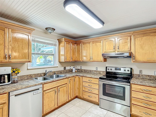 737 Kensington St, Lakeland, FL 33803 - kitchen with light tile patterned floors, a sink, appliances with stainless steel finishes, and under cabinet range hood