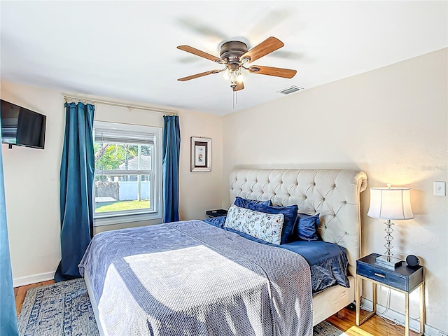 737 Kensington St, Lakeland, FL 33803 - bedroom featuring wood finished floors, visible vents, a ceiling fan, and baseboards