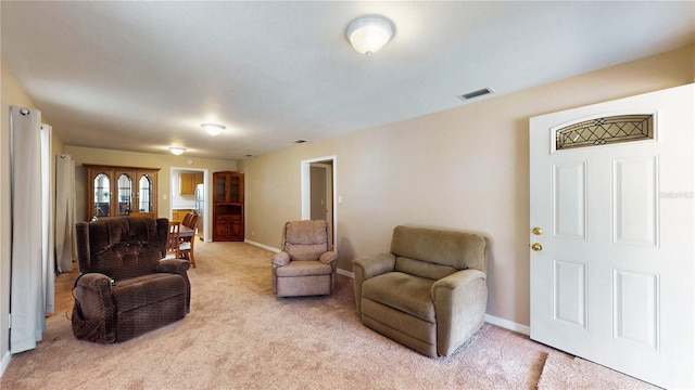 410 Orange St, Bradley, FL 33835 - living room featuring light carpet, visible vents, and baseboards