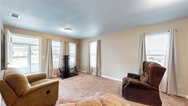 410 Orange St, Bradley, FL 33835 - living room featuring baseboards, visible vents, and light colored carpet