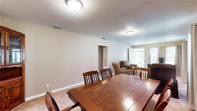 410 Orange St, Bradley, FL 33835 - dining room featuring visible vents, baseboards, and light carpet