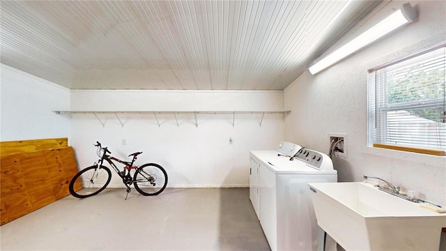 410 Orange St, Bradley, FL 33835 - washroom with a textured wall, wooden ceiling, a sink, and washer and clothes dryer
