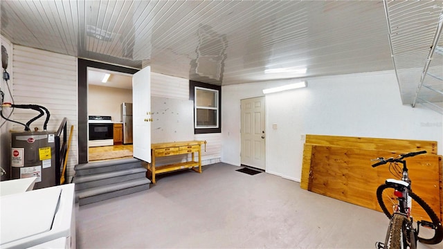 410 Orange St, Bradley, FL 33835 - misc room with water heater and finished concrete flooring