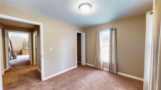410 Orange St, Bradley, FL 33835 - unfurnished bedroom with baseboards, a closet, and light colored carpet