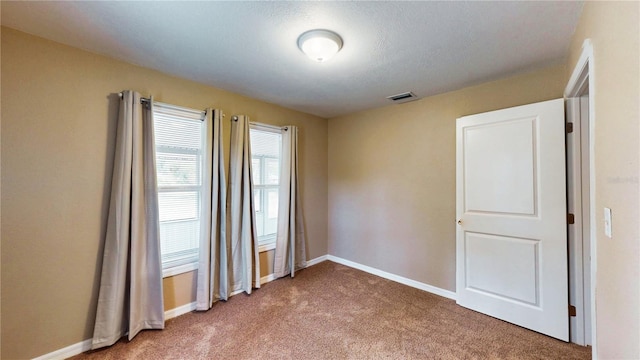410 Orange St, Bradley, FL 33835 - spare room featuring baseboards, carpet flooring, and visible vents