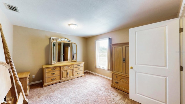 410 Orange St, Bradley, FL 33835 - bedroom with baseboards, light carpet, and visible vents