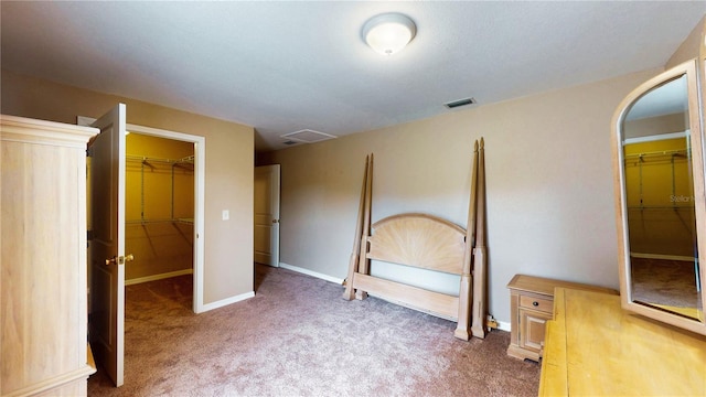 410 Orange St, Bradley, FL 33835 - unfurnished bedroom with baseboards, visible vents, a spacious closet, a closet, and carpet floors