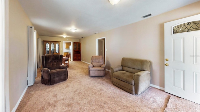 410 Orange St, Bradley, FL 33835 - living area with light carpet, baseboards, and visible vents