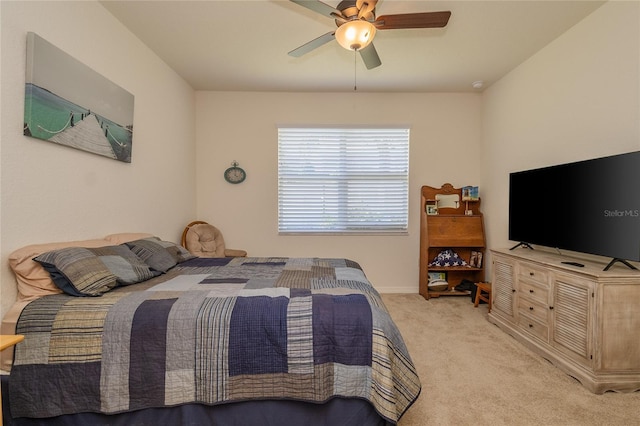 bedroom featuring a ceiling fan and light colored carpet