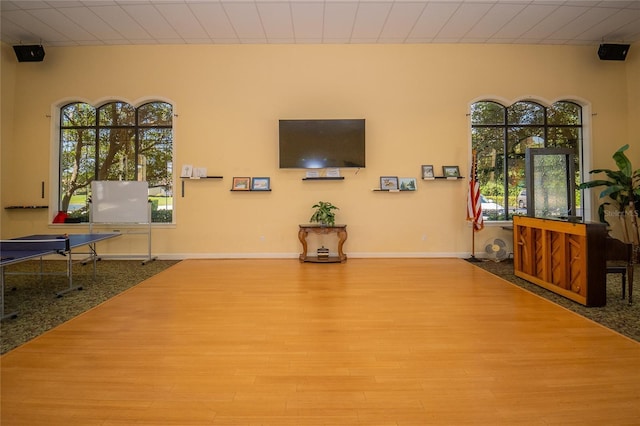 living room featuring wood finished floors and baseboards