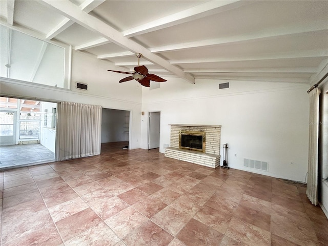 2415 Goldenrod St, Sarasota, FL 34239 - unfurnished living room featuring a ceiling fan, beamed ceiling, a fireplace, high vaulted ceiling, and light stone finish floors