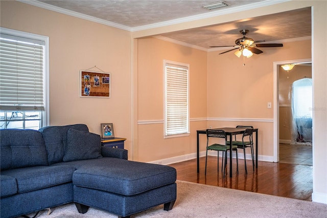 422 E Belmar St, Lakeland, FL 33803 - living area with a ceiling fan, visible vents, a healthy amount of sunlight, and wood finished floors