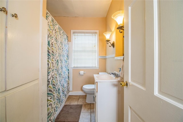 422 E Belmar St, Lakeland, FL 33803 - bathroom featuring vanity, tile patterned flooring, toilet, and curtained shower