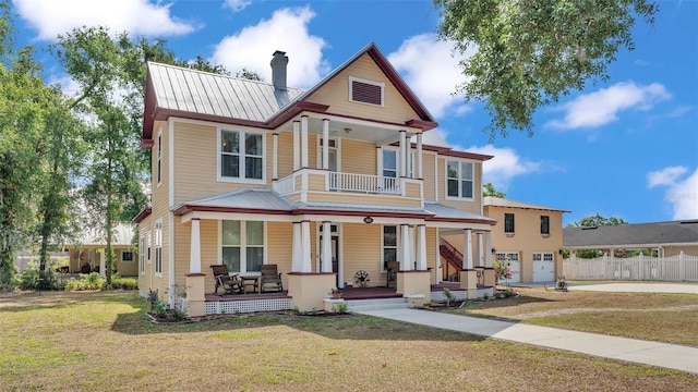 410 S Broadway Ave, Bartow, FL 33830 - victorian house with covered porch, a chimney, a garage, metal roof, and driveway