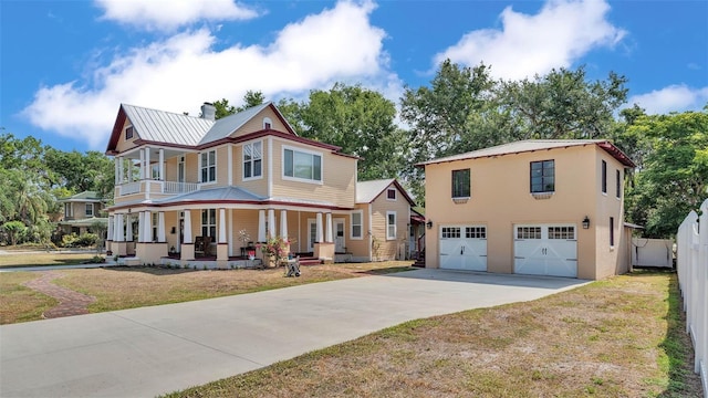410 S Broadway Ave, Bartow, FL 33830 - view of front of home with covered porch, driveway, an attached garage, metal roof, and a chimney