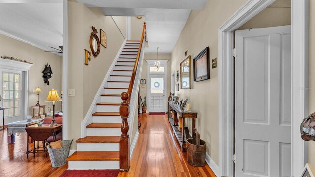 410 S Broadway Ave, Bartow, FL 33830 - stairs featuring hardwood / wood-style flooring and baseboards