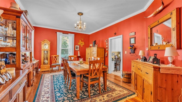 410 S Broadway Ave, Bartow, FL 33830 - dining room with a chandelier, light wood-style flooring, and ornamental molding