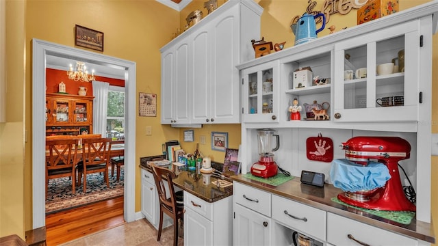 410 S Broadway Ave, Bartow, FL 33830 - bar area featuring a chandelier, ornamental molding, and baseboards