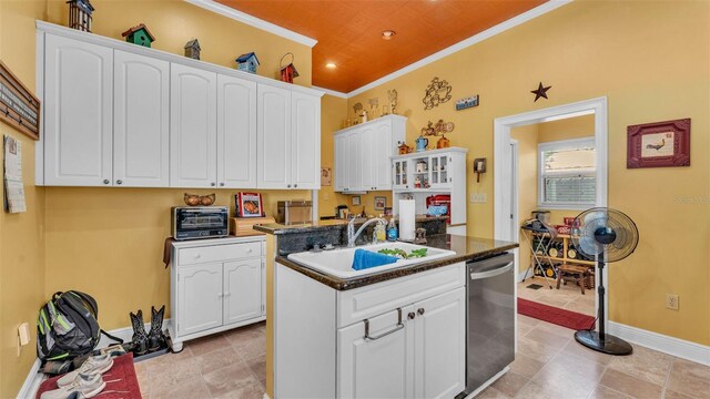 410 S Broadway Ave, Bartow, FL 33830 - kitchen with dishwasher, a sink, ornamental molding, white cabinetry, and a center island with sink