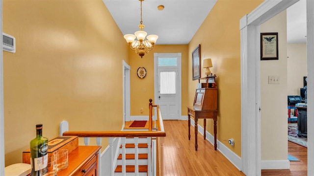 410 S Broadway Ave, Bartow, FL 33830 - foyer featuring a chandelier, light wood-style floors, and baseboards