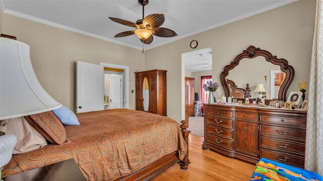 410 S Broadway Ave, Bartow, FL 33830 - bedroom featuring light wood-style flooring, ornamental molding, and ceiling fan