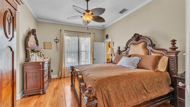 410 S Broadway Ave, Bartow, FL 33830 - bedroom with baseboards, light wood finished floors, ornamental molding, and a ceiling fan