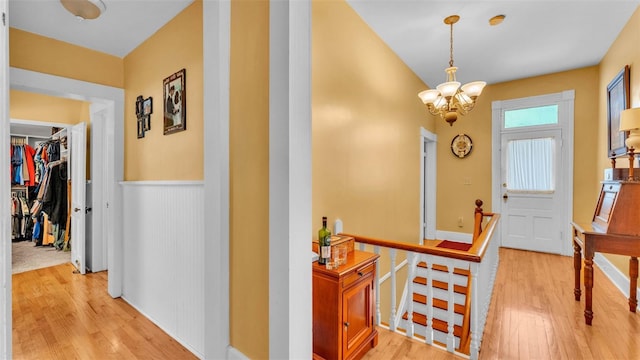 410 S Broadway Ave, Bartow, FL 33830 - corridor featuring an upstairs landing, light wood finished floors, and a chandelier