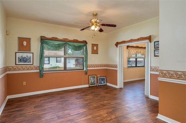unfurnished room with baseboards, ceiling fan, and wood finished floors