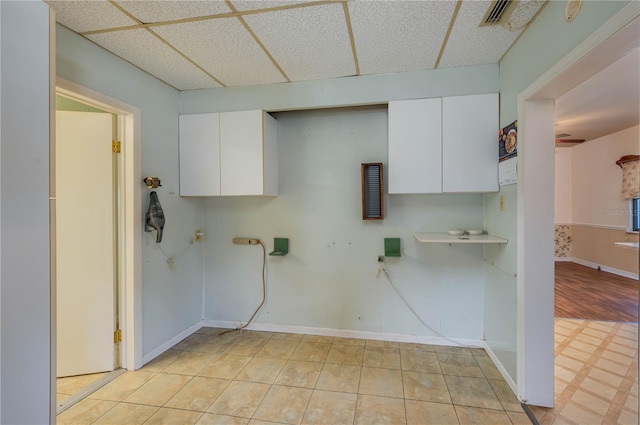 laundry area featuring baseboards