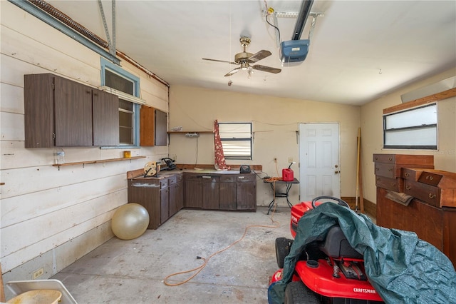 kitchen with dark brown cabinetry, ceiling fan, concrete floors, and plenty of natural light