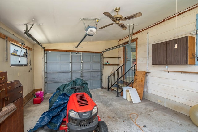 garage with ceiling fan and a garage door opener