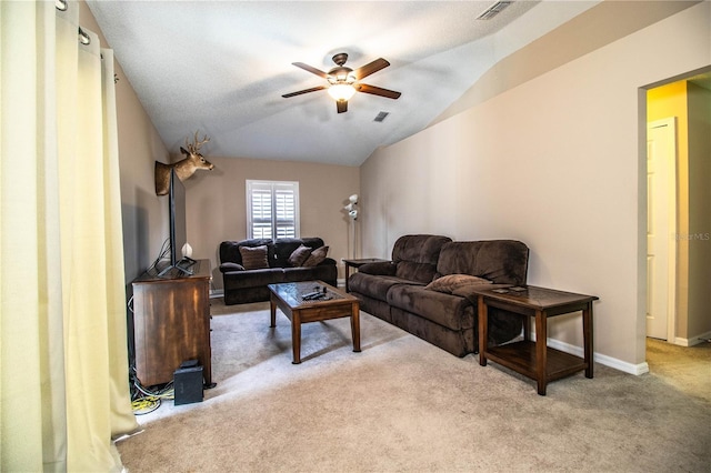 living area featuring a ceiling fan, carpet flooring, lofted ceiling, and visible vents