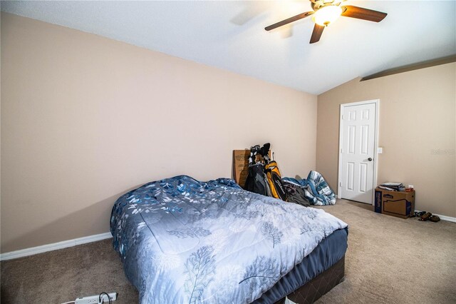 bedroom with lofted ceiling, a ceiling fan, carpet floors, and baseboards