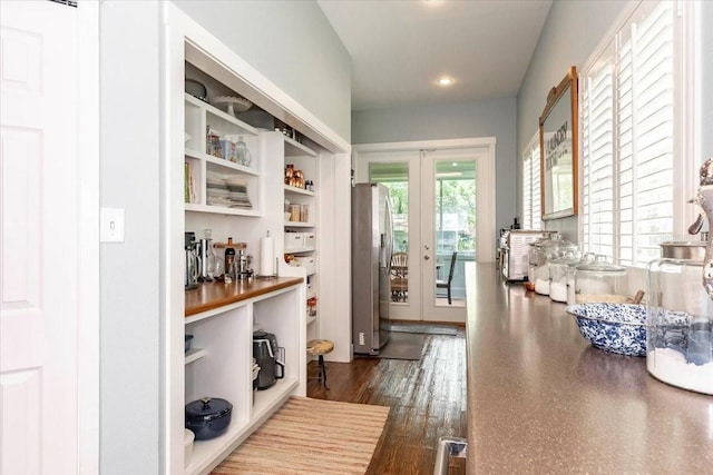 interior space with french doors and recessed lighting