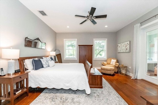 bedroom with dark wood-style flooring, baseboards, visible vents, and recessed lighting