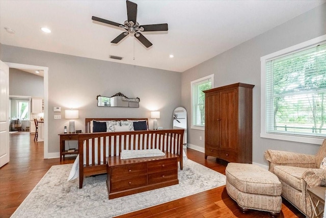 bedroom featuring visible vents, recessed lighting, baseboards, and wood finished floors