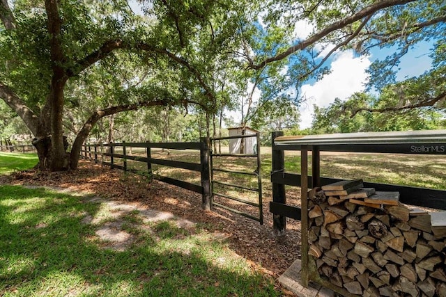 view of gate featuring fence